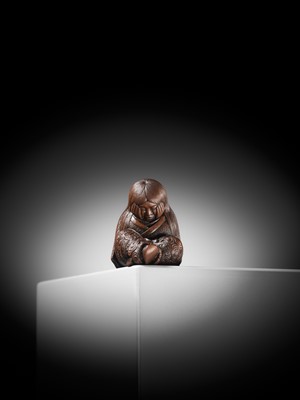Lot 610 - TADATOSHI: A SUPERB NAGOYA SCHOOL WOOD NETSUKE OF A SLEEPING SHOJO