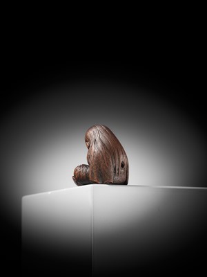 Lot 610 - TADATOSHI: A SUPERB NAGOYA SCHOOL WOOD NETSUKE OF A SLEEPING SHOJO
