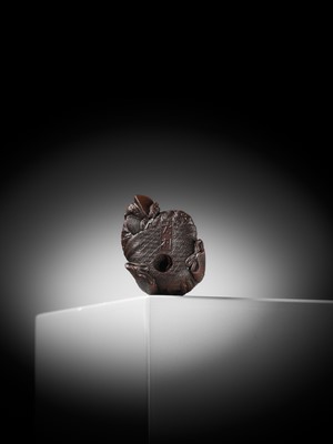 Lot 610 - TADATOSHI: A SUPERB NAGOYA SCHOOL WOOD NETSUKE OF A SLEEPING SHOJO