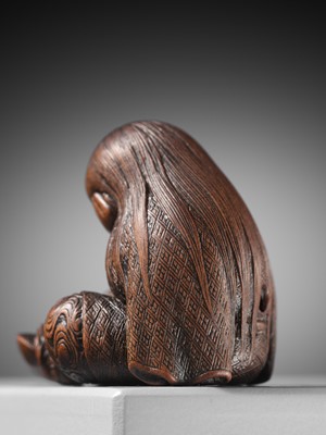 Lot 610 - TADATOSHI: A SUPERB NAGOYA SCHOOL WOOD NETSUKE OF A SLEEPING SHOJO