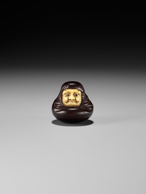 Lot 250 - IPPOSAI: AN AMUSING INLAID IVORY AND WOOD KARAKURI (TRICK) NETSUKE OF A DARUMA DOLL