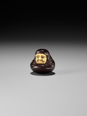 Lot 250 - IPPOSAI: AN AMUSING INLAID IVORY AND WOOD KARAKURI (TRICK) NETSUKE OF A DARUMA DOLL