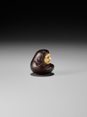 Lot 250 - IPPOSAI: AN AMUSING INLAID IVORY AND WOOD KARAKURI (TRICK) NETSUKE OF A DARUMA DOLL