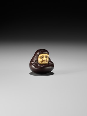 Lot 250 - IPPOSAI: AN AMUSING INLAID IVORY AND WOOD KARAKURI (TRICK) NETSUKE OF A DARUMA DOLL