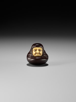 Lot 250 - IPPOSAI: AN AMUSING INLAID IVORY AND WOOD KARAKURI (TRICK) NETSUKE OF A DARUMA DOLL