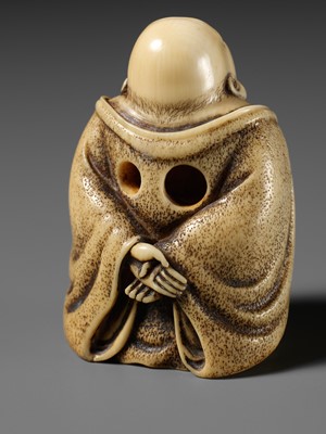 Lot 66 - ANRAKU: A SUPERB IVORY NETSUKE OF HOTEI