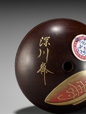 Lot 332 - FUKAGAWASAI: A FINE LACQUER MANJU NETSUKE DEPICTING SHOJO WITH A SAKE JAR AND SAUCER