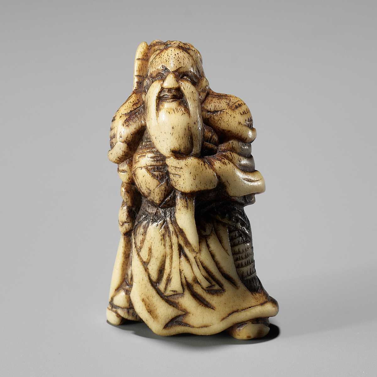 Lot 286 - A GOOD ANTLER NETSUKE OF KAN’U