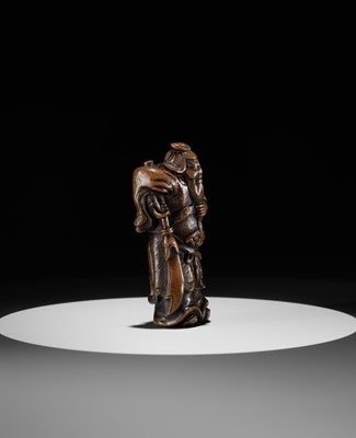 Lot 20 - A POWERFUL WOOD NETSUKE OF KAN’U WITH HIS HALBERD