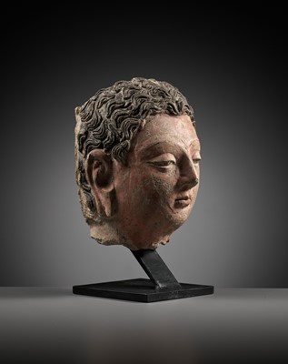 Lot 713 - A POLYCHROME STUCCO HEAD OF BUDDHA, ANCIENT REGION OF GANDHARA, 4TH-5TH CENTURY