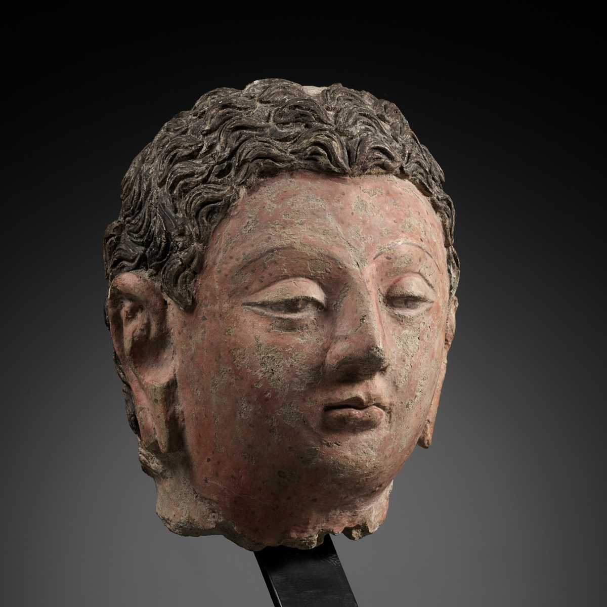 Lot 713 - A POLYCHROME STUCCO HEAD OF BUDDHA, ANCIENT REGION OF GANDHARA, 4TH-5TH CENTURY