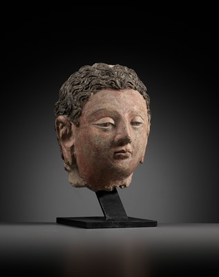 Lot 713 - A POLYCHROME STUCCO HEAD OF BUDDHA, ANCIENT REGION OF GANDHARA, 4TH-5TH CENTURY