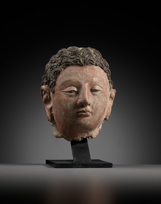 Lot 713 - A POLYCHROME STUCCO HEAD OF BUDDHA, ANCIENT REGION OF GANDHARA, 4TH-5TH CENTURY