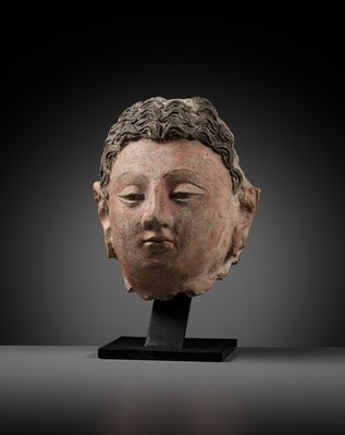 Lot 713 - A POLYCHROME STUCCO HEAD OF BUDDHA, ANCIENT REGION OF GANDHARA, 4TH-5TH CENTURY