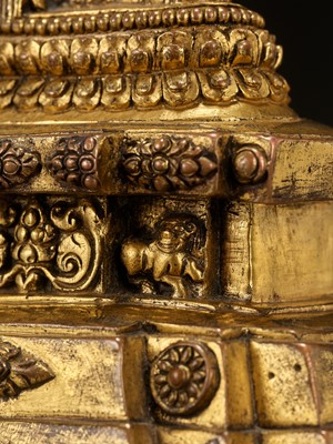 Lot 173 - A GILT-BRONZE FIGURE OF A LAMA ON A STEPPED THRONE, TIBET, 13TH - 14TH CENTURY