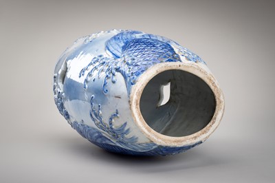 Lot 241 - A LARGE AND HEAVY BLUE AND WHITE ‘KOI’ GARDEN STOOL