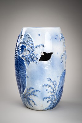 Lot 241 - A LARGE AND HEAVY BLUE AND WHITE ‘KOI’ GARDEN STOOL