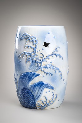 Lot 241 - A LARGE AND HEAVY BLUE AND WHITE ‘KOI’ GARDEN STOOL