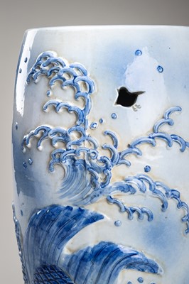 Lot 241 - A LARGE AND HEAVY BLUE AND WHITE ‘KOI’ GARDEN STOOL