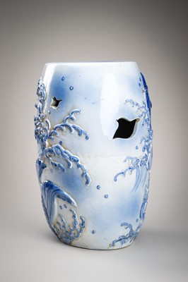 Lot 241 - A LARGE AND HEAVY BLUE AND WHITE ‘KOI’ GARDEN STOOL