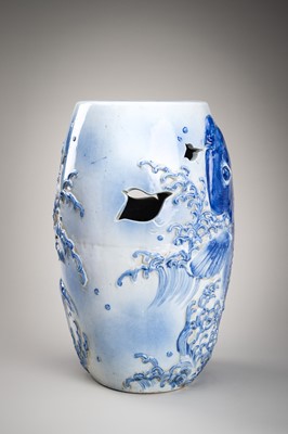 Lot 241 - A LARGE AND HEAVY BLUE AND WHITE ‘KOI’ GARDEN STOOL
