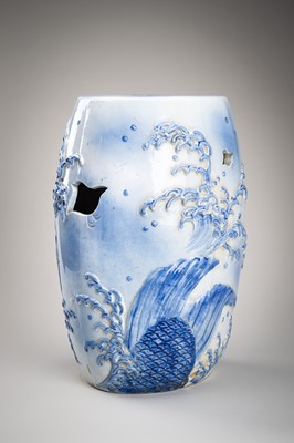 Lot 241 - A LARGE AND HEAVY BLUE AND WHITE ‘KOI’ GARDEN STOOL