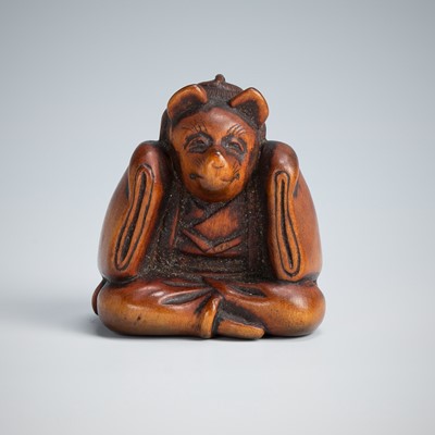 Lot 390 - A CHARMING WOOD NETSUKE OF A KARAKO WEARING A KITSUNE MASK