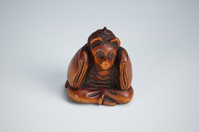 Lot 390 - A CHARMING WOOD NETSUKE OF A KARAKO WEARING A KITSUNE MASK