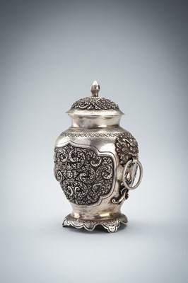 A FINE SILVER VASE WITH MASK HANDLES