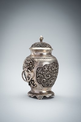 A FINE SILVER VASE WITH MASK HANDLES