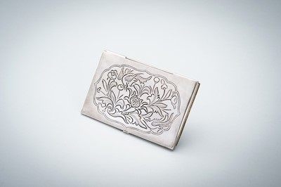 AN OPENWORK SILVER CARD CASE