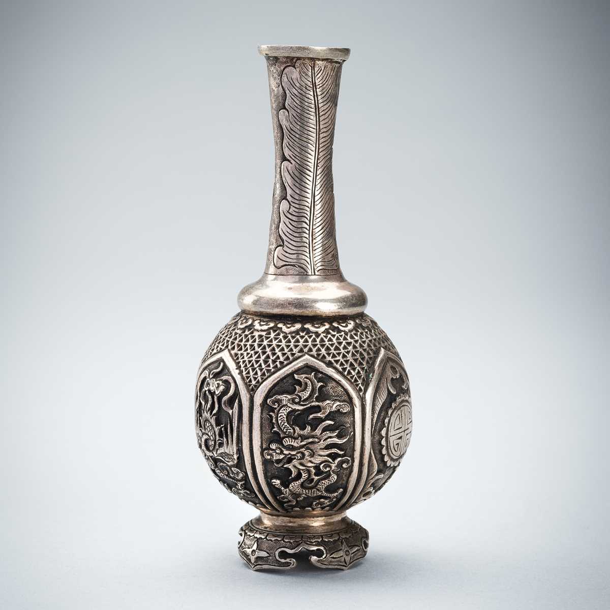 Lot 985 - A TALL SILVER VASE WITH MYTHICAL CREATURES