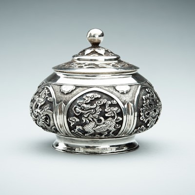A LIDDED SILVER BOX WITH MYTHICAL CREATURES