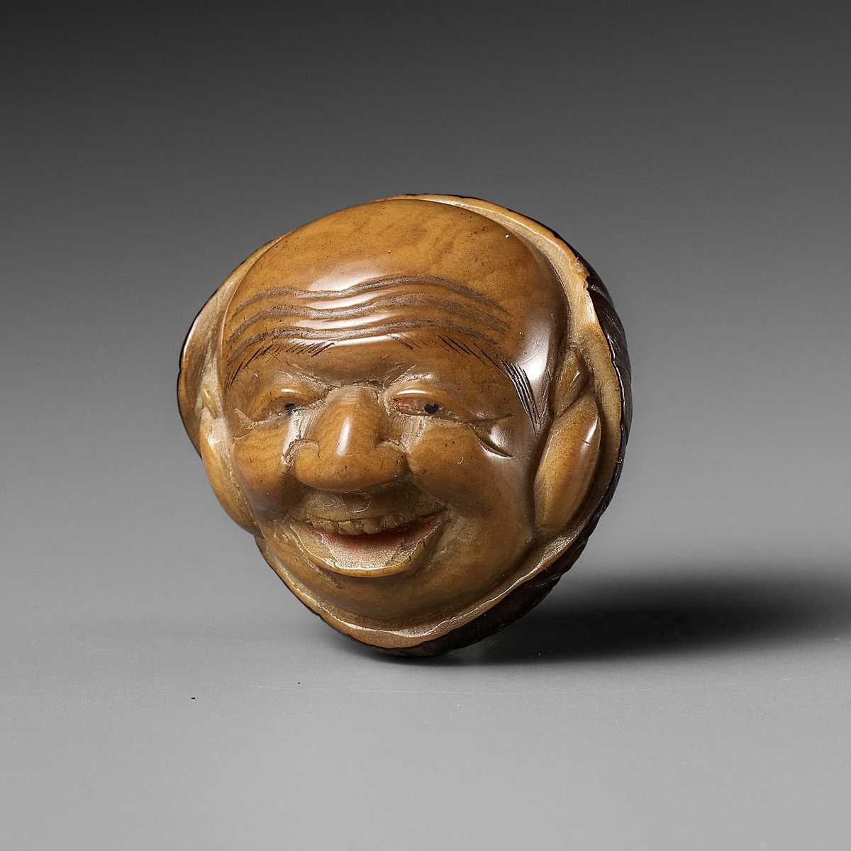 Lot 465 - A COROZO NUT NETSUKE OF DAIKOKU