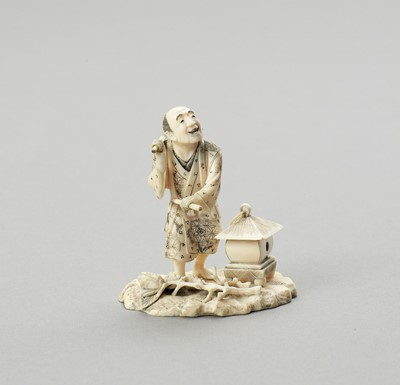 Lot 579 - AN IVORY OKIMONO OF A TEMPLE DRUMMER