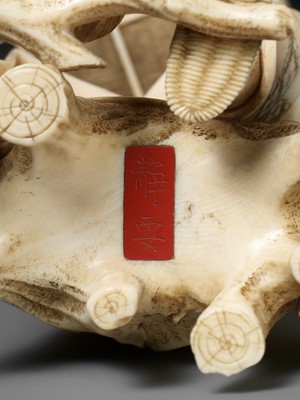Lot 170 - SEIYO: AN IVORY OKIMONO OF A MAN FEEDING HIS CHICKENS