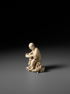 Lot 170 - SEIYO: AN IVORY OKIMONO OF A MAN FEEDING HIS CHICKENS