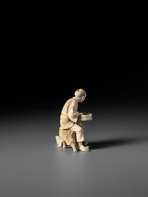 Lot 170 - SEIYO: AN IVORY OKIMONO OF A MAN FEEDING HIS CHICKENS