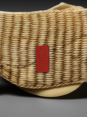 Lot 277 - SEIHO: AN IVORY OKIMONO OF A MAN AND HIS CAT