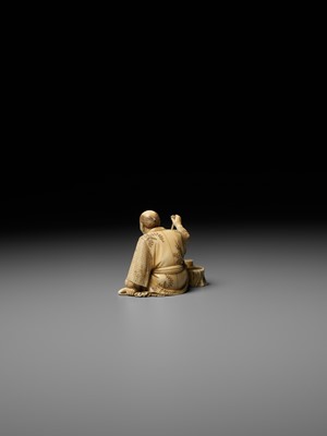 Lot 277 - SEIHO: AN IVORY OKIMONO OF A MAN AND HIS CAT