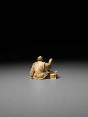 Lot 277 - SEIHO: AN IVORY OKIMONO OF A MAN AND HIS CAT