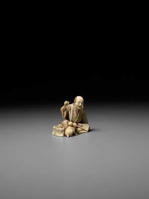 Lot 277 - SEIHO: AN IVORY OKIMONO OF A MAN AND HIS CAT