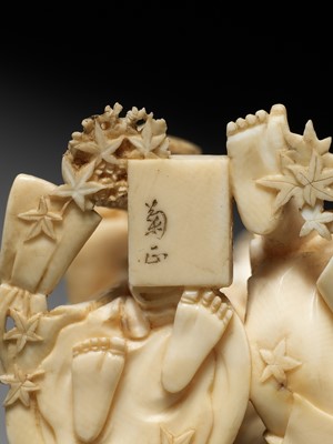 Lot 165 - KIKUMASA: A FINE IVORY OKIMONO OF A WOMAN SCOLDING A DRUNKARD