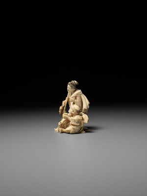Lot 165 - KIKUMASA: A FINE IVORY OKIMONO OF A WOMAN SCOLDING A DRUNKARD