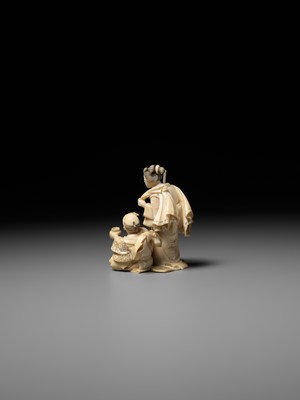 Lot 165 - KIKUMASA: A FINE IVORY OKIMONO OF A WOMAN SCOLDING A DRUNKARD