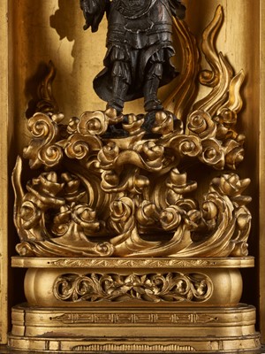Lot 69 - A GILT AND LACQUERED WOOD ZUSHI (PORTABLE SHRINE) CONTAINING A LACQUERED WOOD FIGURE OF BISHAMONTEN, EDO