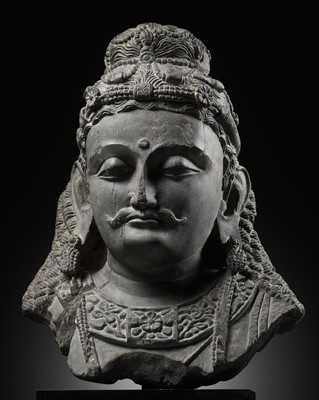 Lot 220 - A RARE AND LARGE SCHIST HEAD OF A BODHISATTVA, ANCIENT REGION OF GANDHARA, 2ND-3RD CENTURY