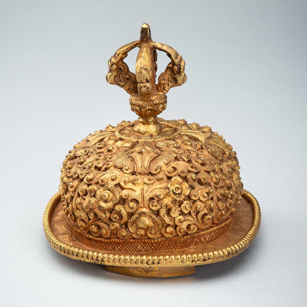 Lot 1045 - A TIBETAN GILT COPPER KAPALA, c. 1900s