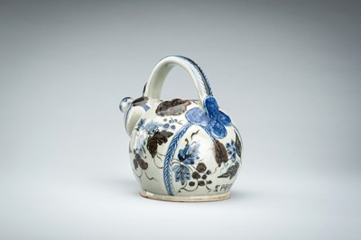 Lot 250 - A CERAMIC POURING VESSEL DEPICTING GRAPEVINES, KENDI