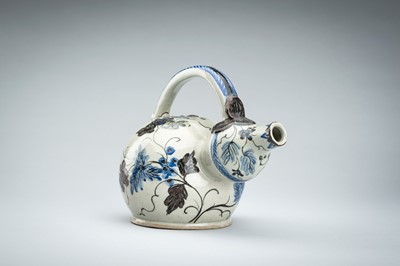 Lot 250 - A CERAMIC POURING VESSEL DEPICTING GRAPEVINES, KENDI